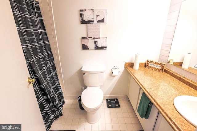 bathroom featuring tile patterned floors, curtained shower, vanity, and toilet