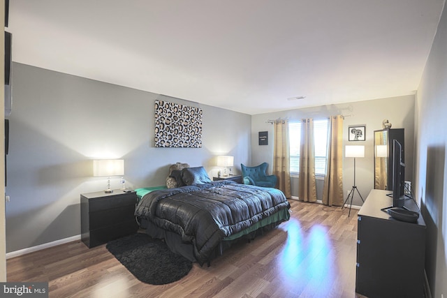 bedroom featuring hardwood / wood-style flooring