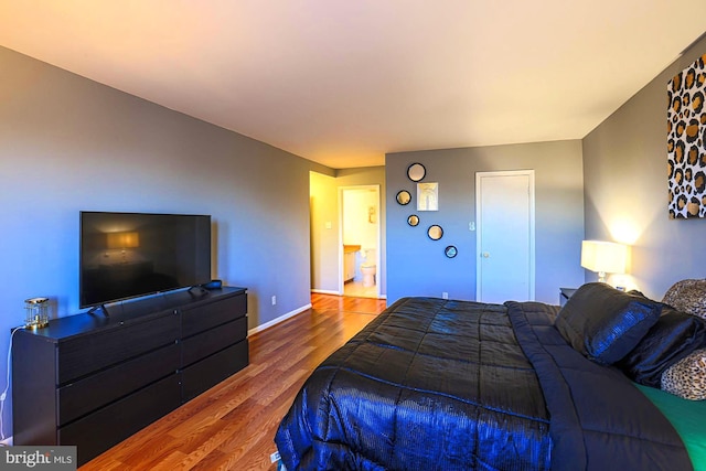 bedroom featuring hardwood / wood-style flooring