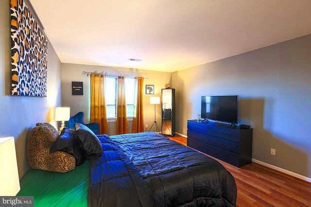 bedroom featuring wood-type flooring