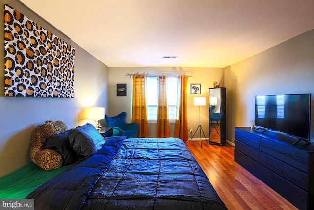 bedroom featuring hardwood / wood-style flooring