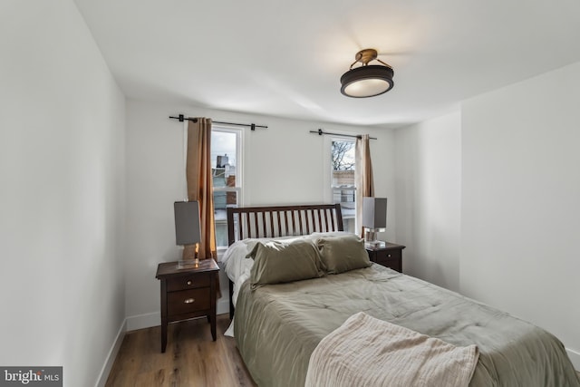 bedroom with wood-type flooring