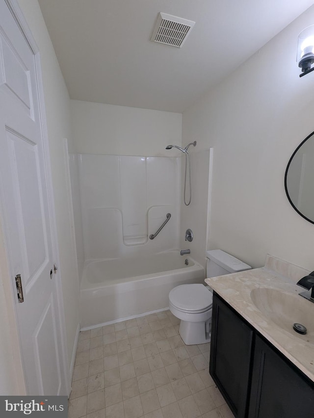 full bathroom featuring washtub / shower combination, vanity, and toilet