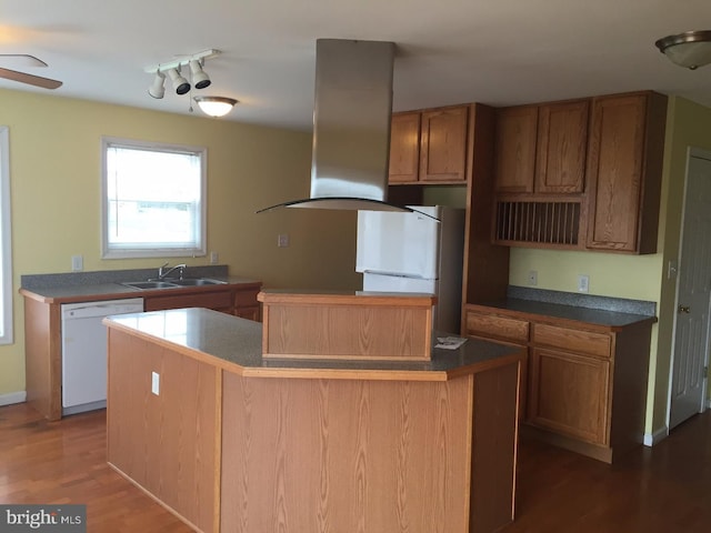 kitchen with white dishwasher, a kitchen island, sink, and island exhaust hood