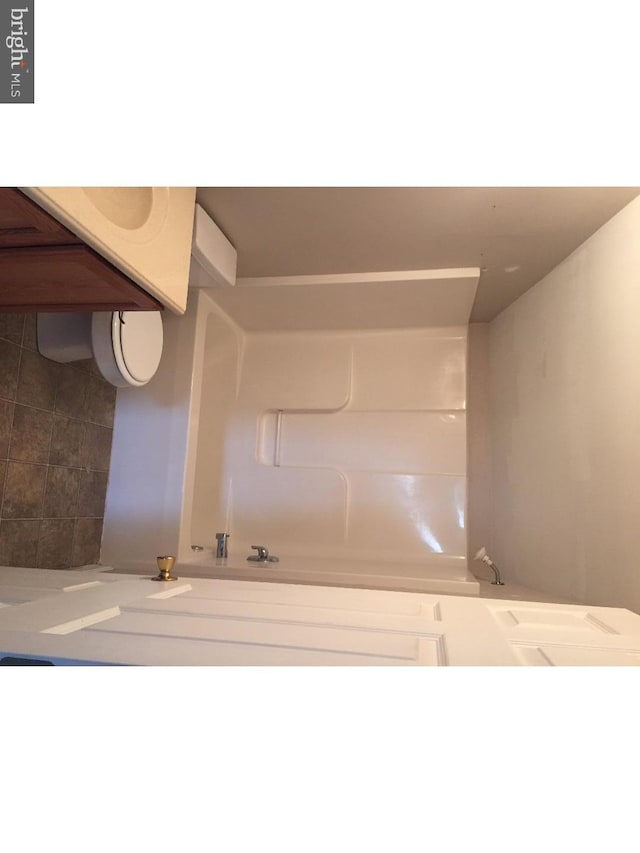 bathroom featuring a tub to relax in