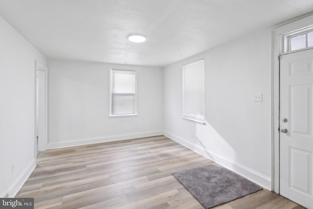 spare room with light wood-type flooring