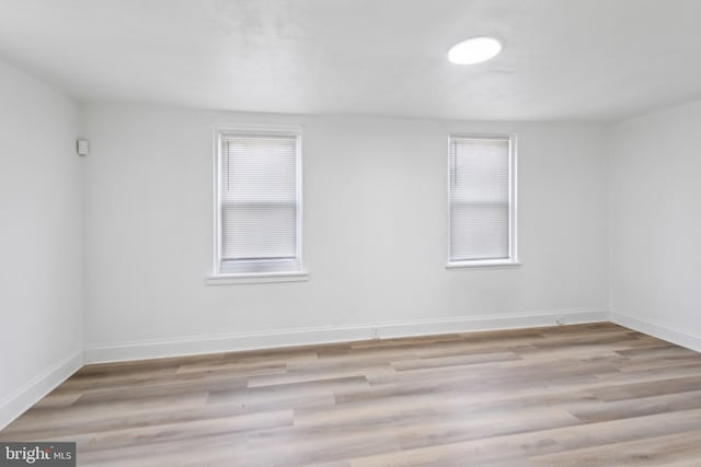 spare room featuring light hardwood / wood-style flooring