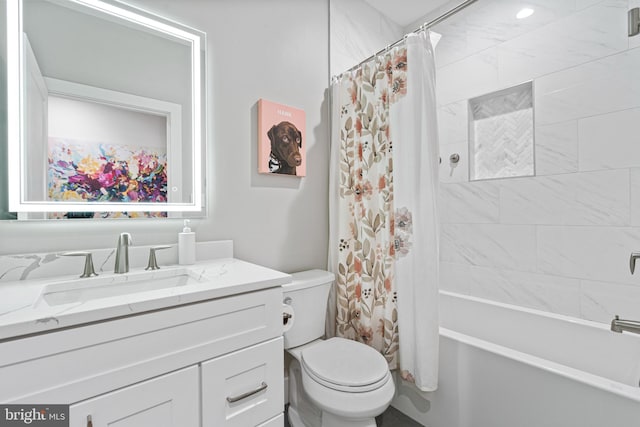 full bathroom with vanity, shower / bath combo, and toilet