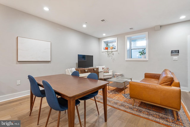 dining space with light wood-type flooring