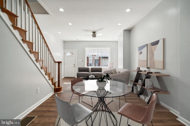 dining room with dark hardwood / wood-style floors and ceiling fan