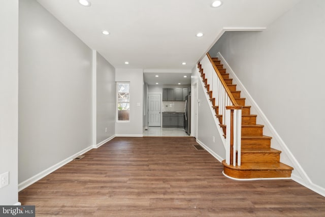 foyer entrance featuring hardwood / wood-style flooring