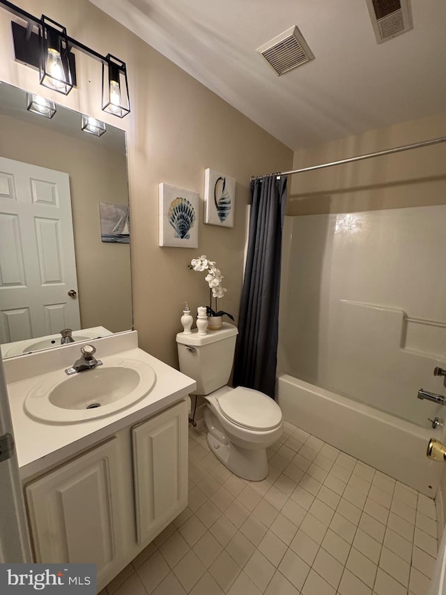 bathroom featuring toilet, shower / tub combo, visible vents, and vanity