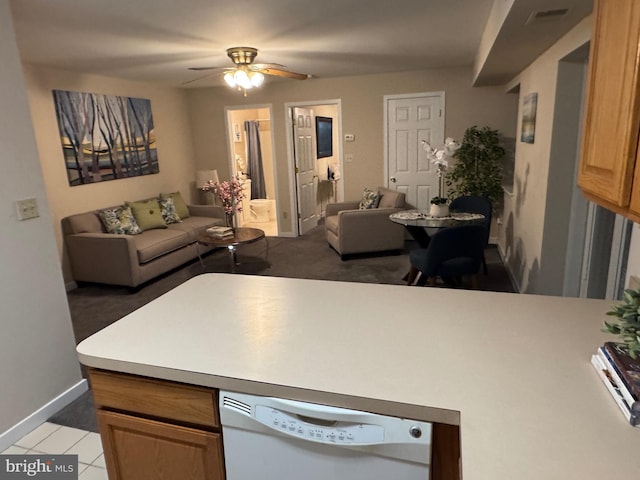 kitchen with white dishwasher, visible vents, open floor plan, and light countertops