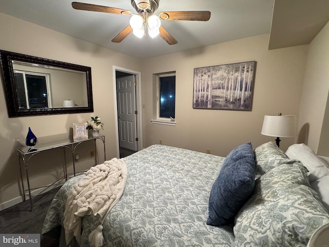 bedroom featuring ceiling fan, carpet, and baseboards