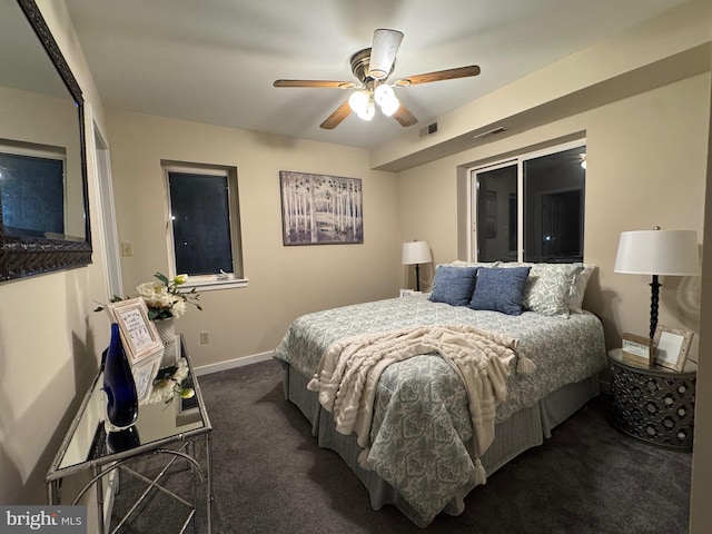 bedroom featuring ceiling fan, carpet flooring, visible vents, and baseboards