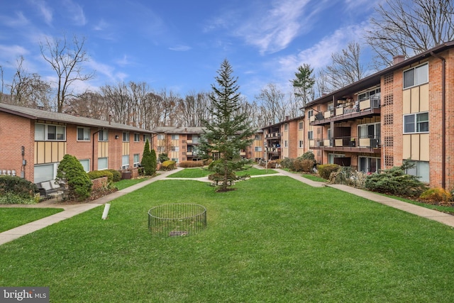 view of property's community featuring a yard