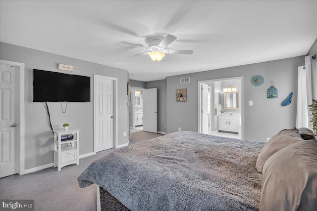 carpeted bedroom with ceiling fan and connected bathroom