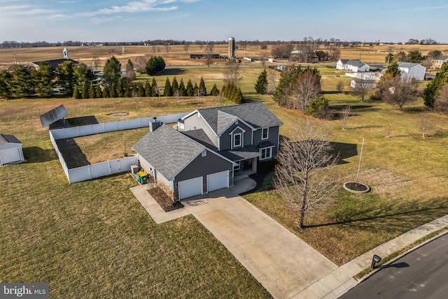 birds eye view of property featuring a rural view