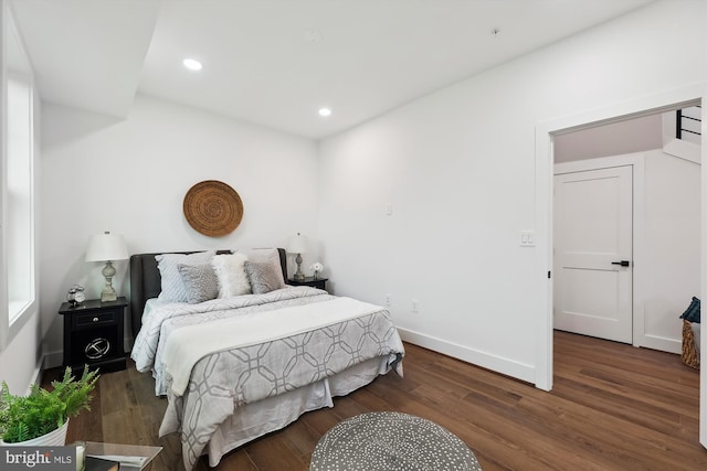 bedroom featuring dark wood-type flooring