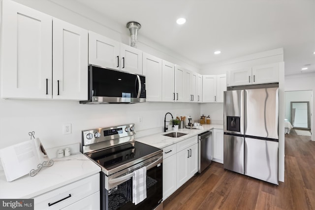 kitchen featuring white cabinetry, sink, dark hardwood / wood-style floors, and appliances with stainless steel finishes