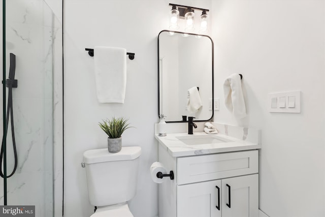 bathroom with vanity, toilet, and walk in shower