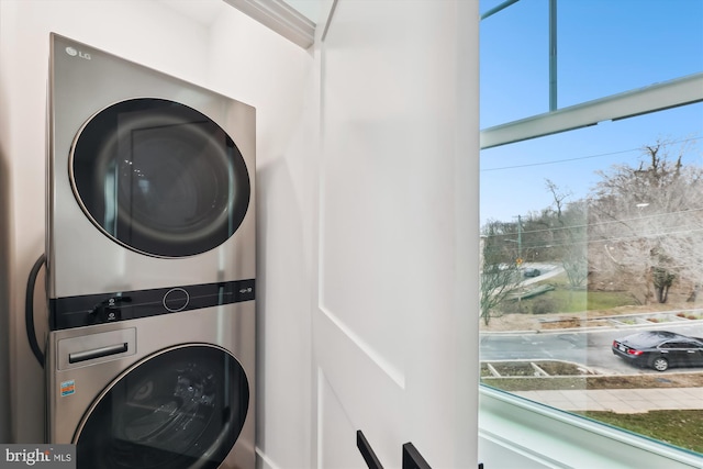 laundry room featuring stacked washer and clothes dryer