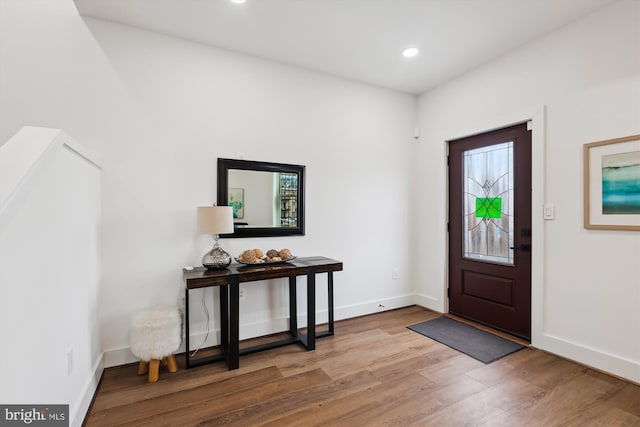 entryway with hardwood / wood-style flooring