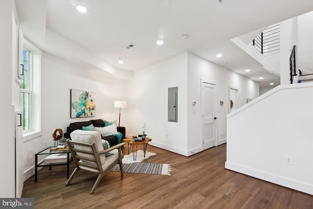 sitting room featuring dark wood-type flooring and electric panel