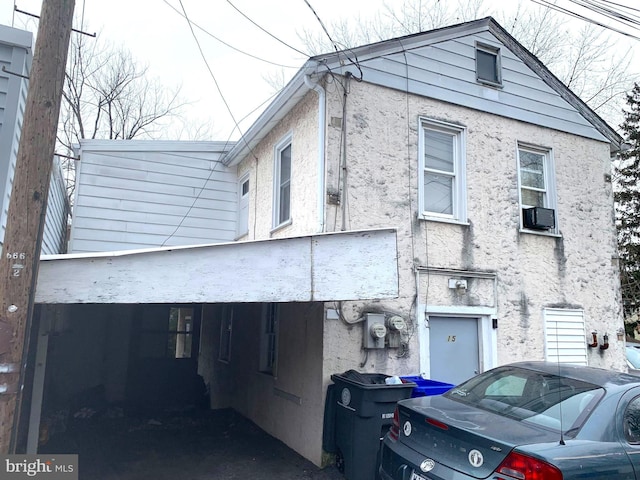 view of property exterior featuring a carport