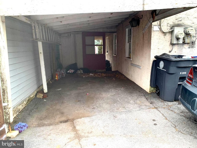 exterior space with a carport