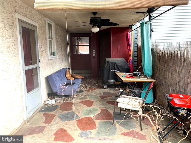 view of patio / terrace with ceiling fan and area for grilling