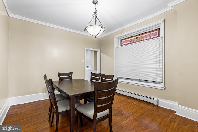 dining space with dark hardwood / wood-style flooring, crown molding, and a baseboard heating unit