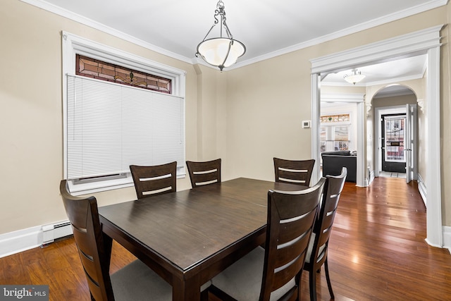 dining room with ornamental molding, a baseboard radiator, and dark wood-type flooring