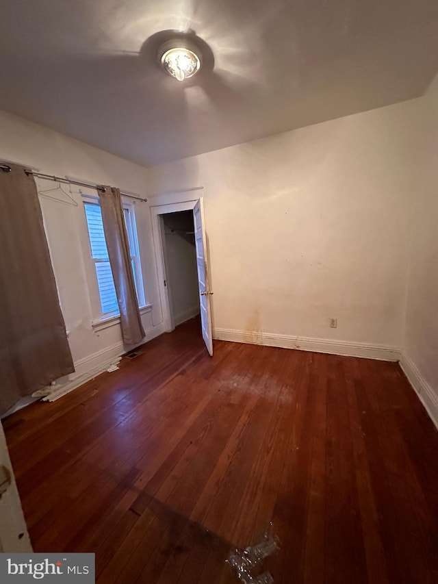 unfurnished room featuring dark hardwood / wood-style floors