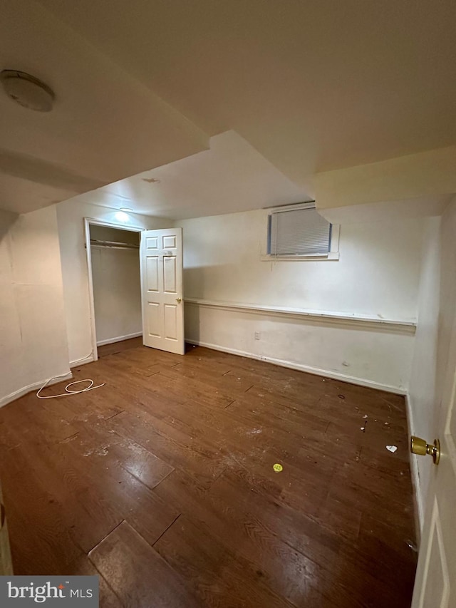 bonus room with wood-type flooring