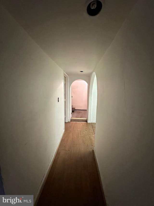 corridor with light hardwood / wood-style flooring