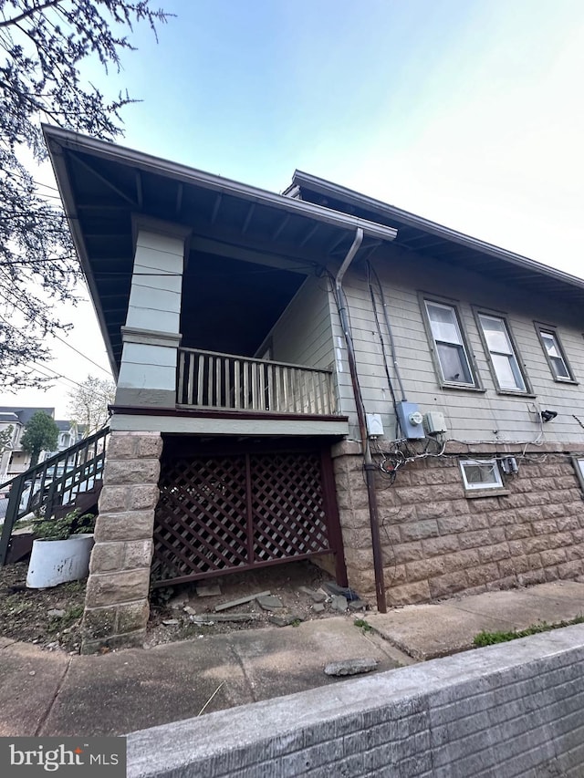 view of property exterior featuring a balcony