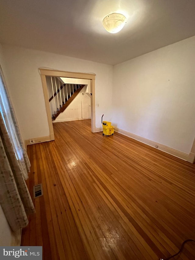 unfurnished room featuring hardwood / wood-style floors