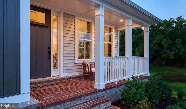 property entrance with covered porch