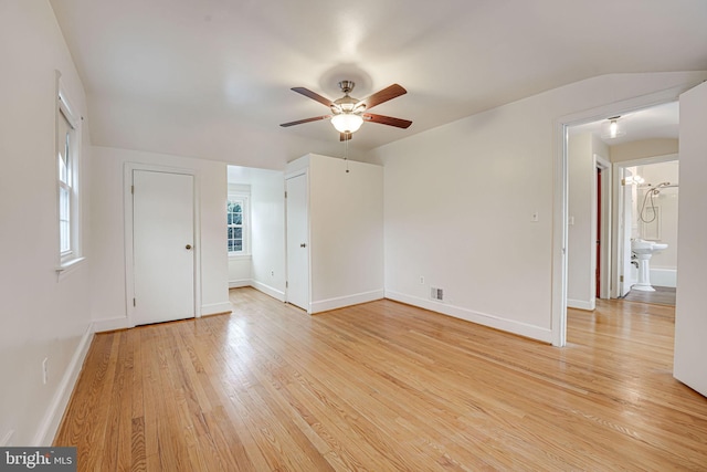 unfurnished room featuring light wood-type flooring and ceiling fan