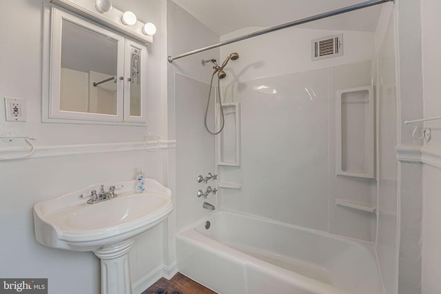 bathroom with shower / bathtub combination