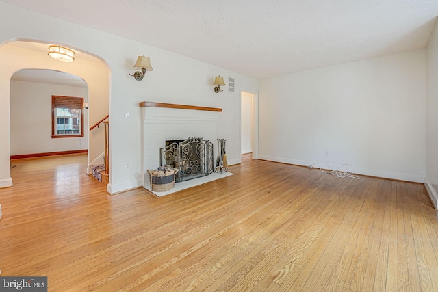 unfurnished living room with light hardwood / wood-style flooring