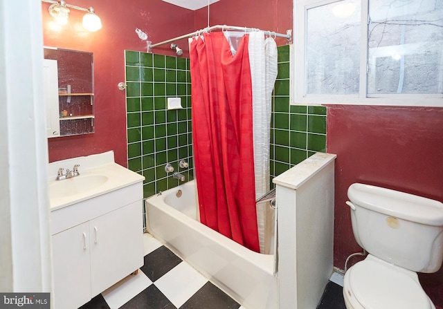 full bathroom featuring vanity, toilet, and shower / bath combo with shower curtain