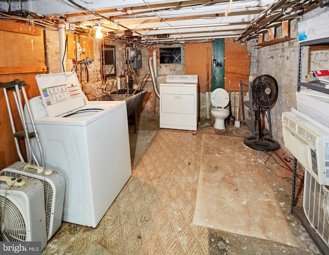 laundry room with washing machine and clothes dryer