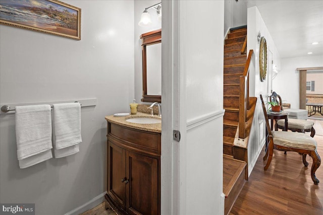 bathroom featuring hardwood / wood-style flooring and vanity