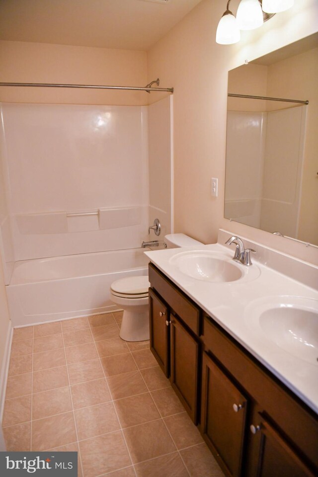 full bathroom with tile patterned floors, toilet, vanity, and tub / shower combination