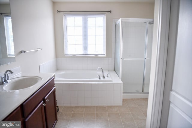 bathroom featuring tile patterned flooring, vanity, and independent shower and bath