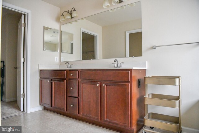 bathroom featuring tile patterned flooring and vanity