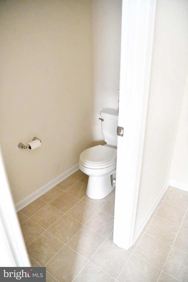 bathroom with tile patterned floors and toilet