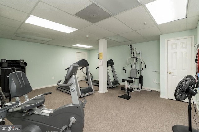 workout room with carpet and a drop ceiling